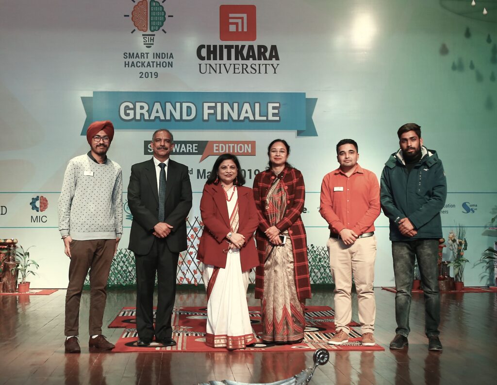 People standing on stage at the grand finale of Chitrakar University's Entrepreneurship Summit.