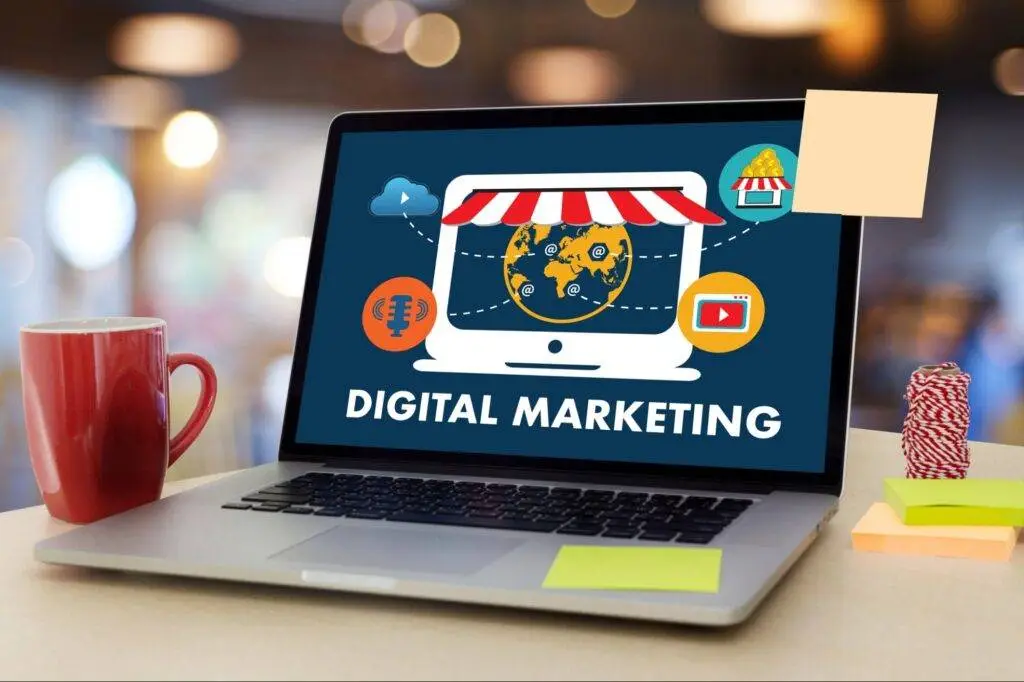 A graphic showing a laptop with a digital marketing strategy on the screen, highlighting its effectiveness for business promotion.